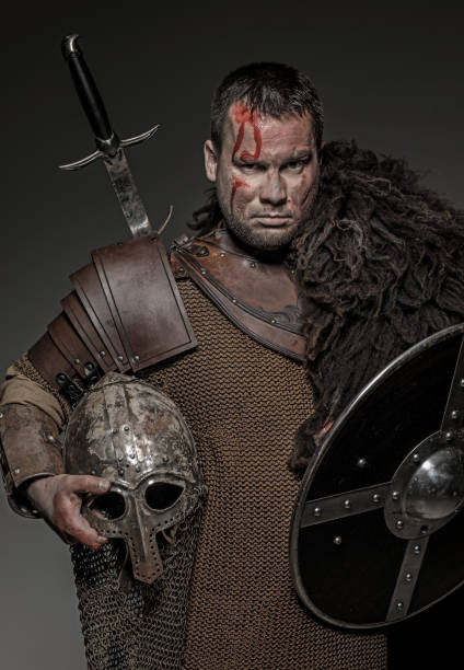 istock Weapon wielding viking warrior brunette male in studio shot 914038838