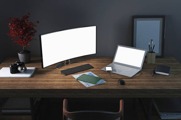 istock In home office desk with computer monitor and laptop 914045514