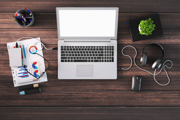 Knolling - In home office desk with laptop with blank screen. blank wall, creative mess on the table. copy space background mock up template