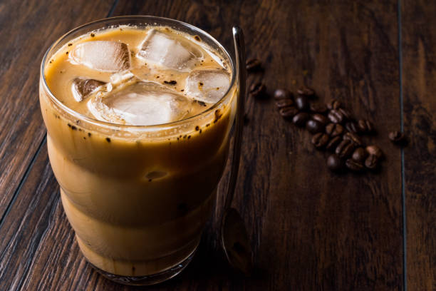 istock Instant Cold Coffee with Milk, Ice, Spoon and Coffee Beans. 914049654