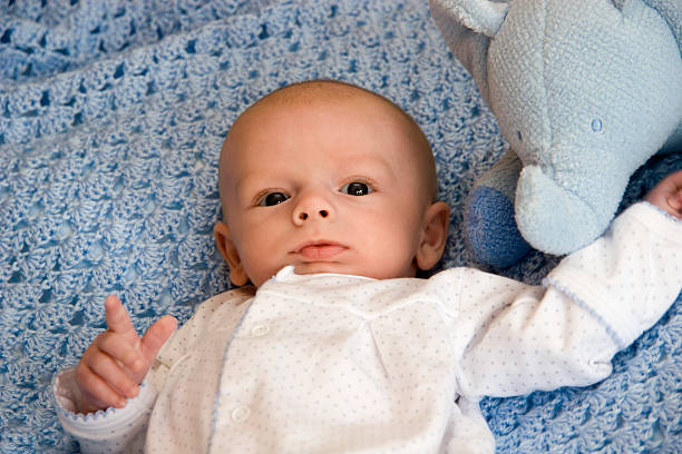 istock Baby Boy with Stuffed Animal 91405510