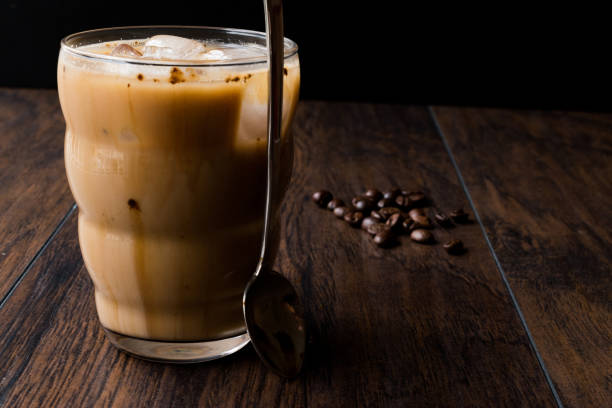 istock Instant Cold Coffee with Milk, Ice, Spoon and Coffee Beans. 914056782