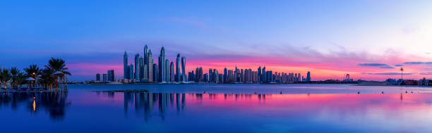 istock Dubai skyline with purple sky at sunset 914057974
