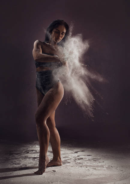 istock Contemporary dancer performing in cloud of powder 914058538
