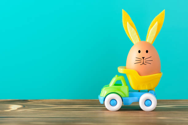 Egg with bunny ears in small truck
