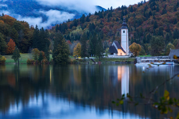 istock Church tower and stone bridge at Lake Bohinj 914067468