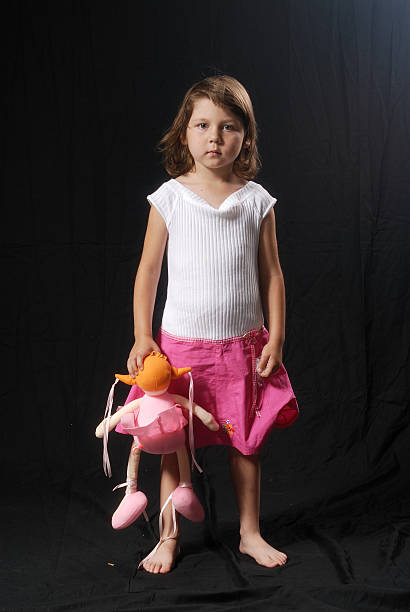 View of a little blonde girl playing