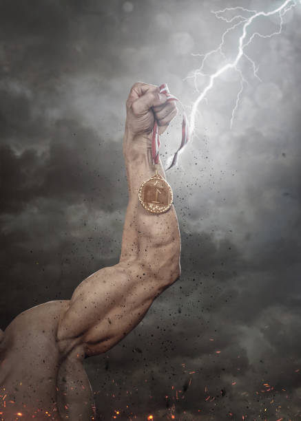 istock Cropped male's arm with gold medal. 914072760