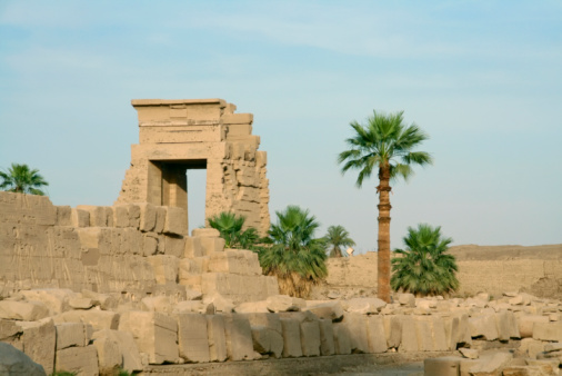 Karnak Temple, Luxor, Egypt - July 21, 2022: The Karnak Temple Complex, commonly known as Karnak  comprises a vast mix of decayed temples, pylons, chapels, and other buildings near Luxor, Egypt. Construction at the complex began during the reign of Senusret I (reigned 1971–1926 BCE) in the Middle Kingdom (around 2000–1700 BCE) and continued into the Ptolemaic Kingdom (305–30 BCE), although most of the extant buildings date from the New Kingdom. \n\nIt is part of the monumental city of Thebes (Luxor), and in 1979 it was inscribed on the UNESCO World Heritage List along with the rest of the city.