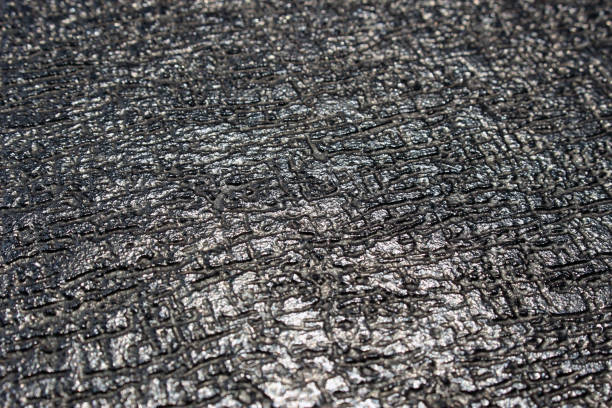 istock Dark uneven metal background in monocrome 914073502