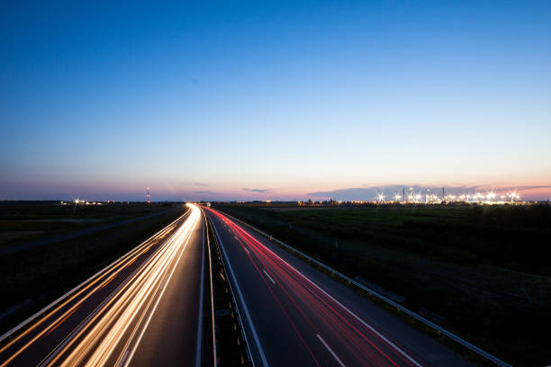 istock Cars speeding on a highway 914074844