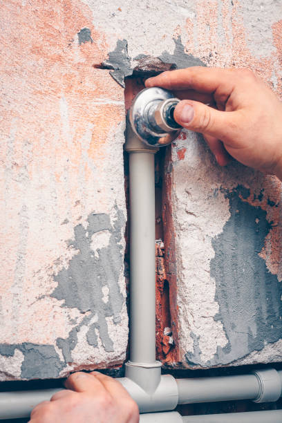 istock The plumber works in plumbing, works with plastic pipes 914077260