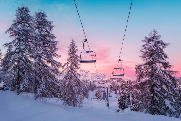 istock Winter mountains panorama with ski slopes and ski lifts 914077342
