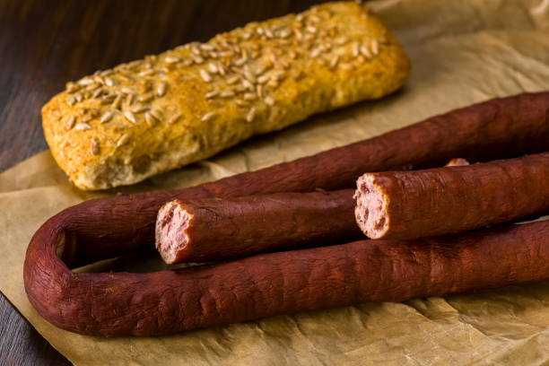 istock Takeaway sausage - packed in gray paper still tastes great 914077478