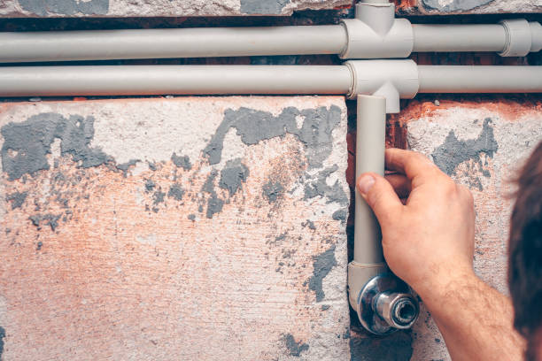 istock The plumber works in plumbing, works with plastic pipes 914078456