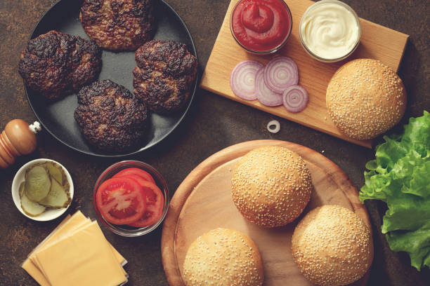 istock Fresh ingredients for homemade hamburgers on rusty table. 914081352