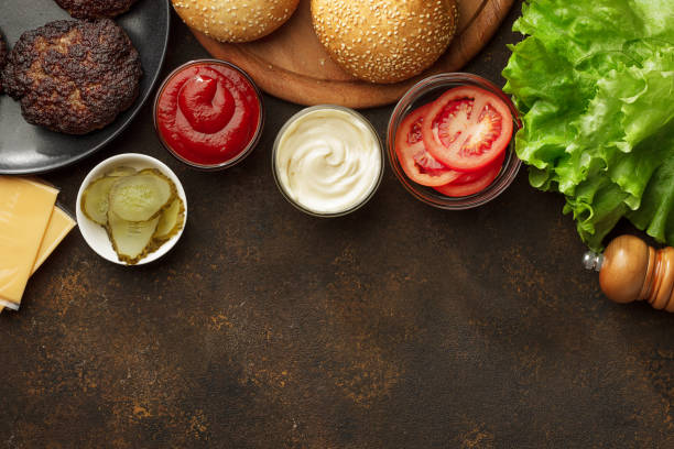 Burgers ingredients for cooking homemade snacks with copy space. stock photo