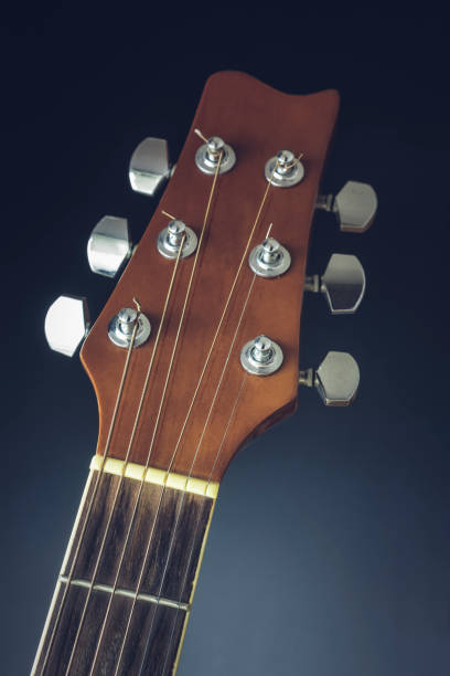 istock Close-up of a guitar on a dark background 914081596