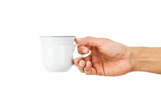 istock Man hand holding white coffee cup isolated on white background 914082454