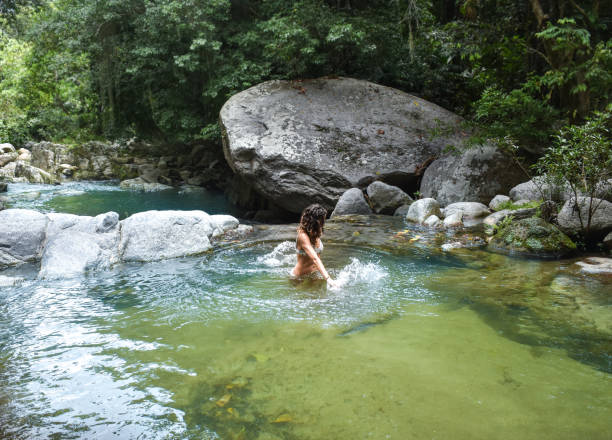 istock Woman playing in river - Photography 914088932