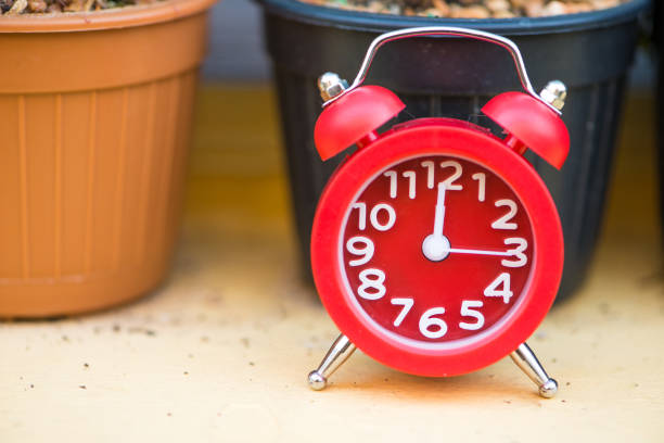 Red alarm clock show time background and concept
