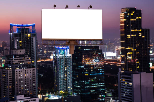 istock Blank white billboard and the night city building - can advertisement for display or montage product or business. 914090008