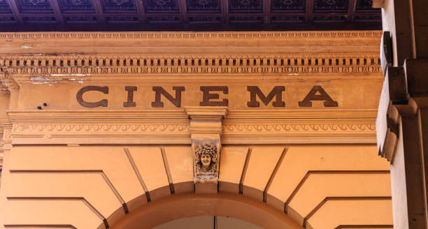 istock Sign for Old Cinema on Stone Arch in Florence 914096424