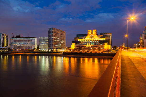 SIS Building In London At Night The modern Secret Intelligence Service building in Vauxhall, London at night with the Vauxhall Bridge in the foreground mi6 stock pictures, royalty-free photos & images