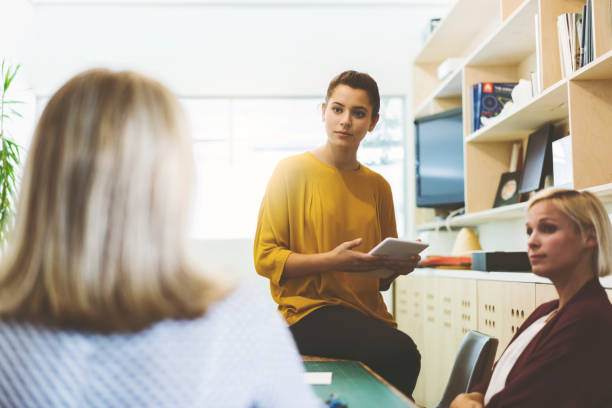 istock Businesswomen discussing in new office 914096918