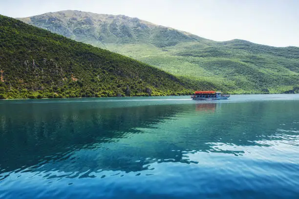 pleasure boat taking passengers across Lake Ohrid from Ohrid town to Sveti Naum monastery complex, Macedonia