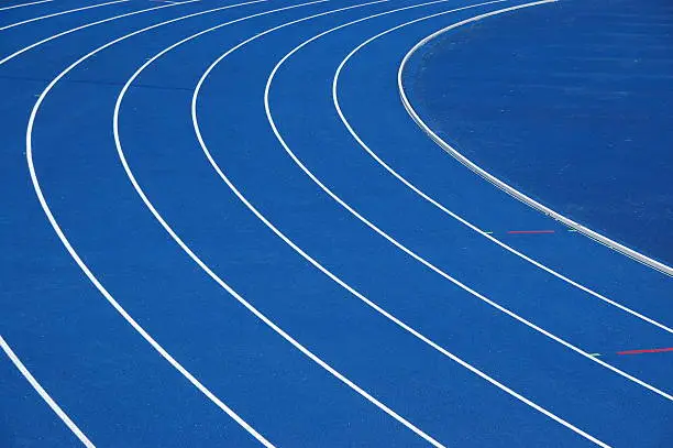 Photo of Blue running track with white lines