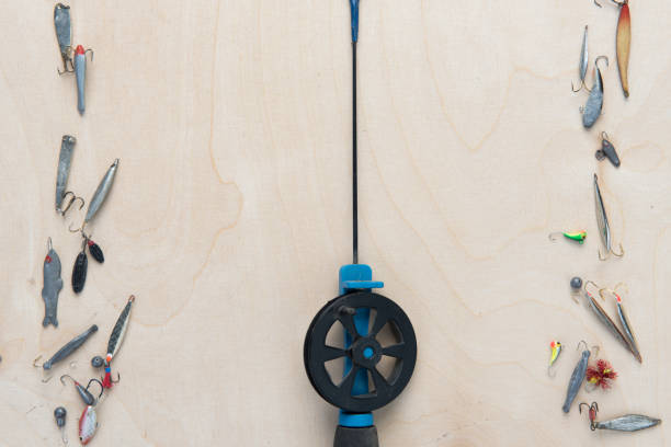 istock Fishing accessories on a wooden background 914107480
