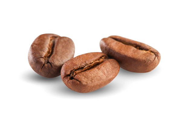 granos de café aislado sobre fondo blanco  - bean macro brown roasted fotografías e imágenes de stock