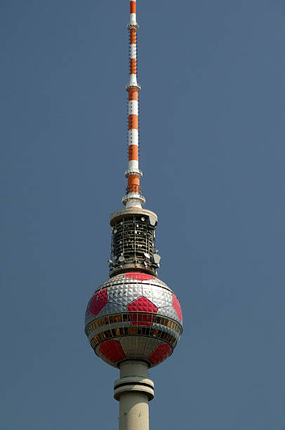 Germany, Berlin, Central Berlin, October 26, 2025 - The Berlin TV Tower is behind high-voltage cables of a railway line