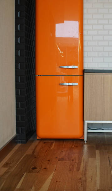 istock skinny orange fridge 914114522
