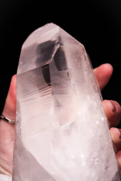 istock Hand holding mountain crystal berg clear quartz 914123010