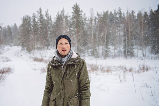 istock Man out in nature during snowy day in winter 914126404