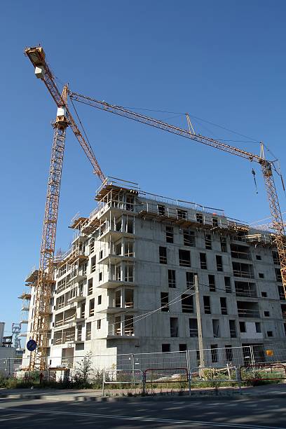 Cranes over building site stock photo