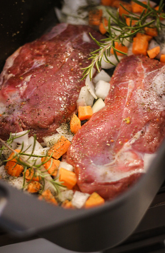Sunday Roast preparation with duck roast, vegetables and rosemary