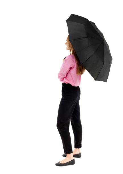 istock young business woman under an umbrella 914137686