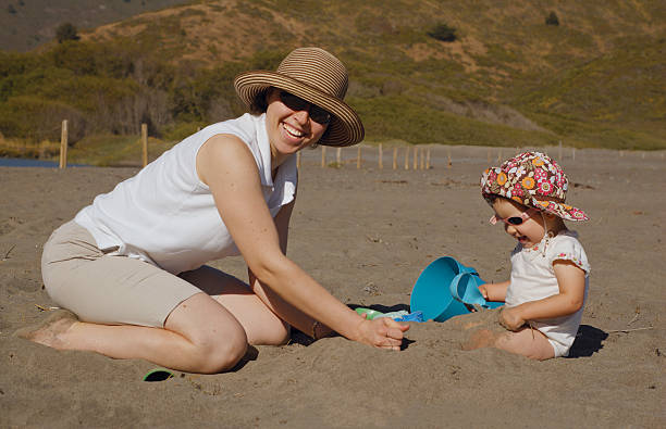 istock Mother and daughter on the beach 91413839