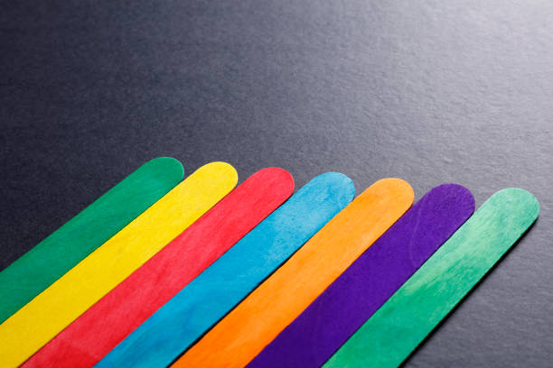 Colorful abstract background made of popsicle sticks minimal creative concept.
