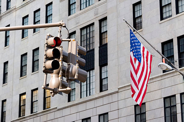 Traffic lights and the American flag stock photo