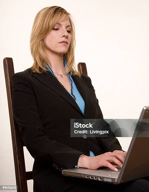 Serious Young Attractive Businesswoman Works On Her Laptop Stock Photo - Download Image Now