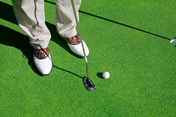 Golf player trying to make the putt stock photo
