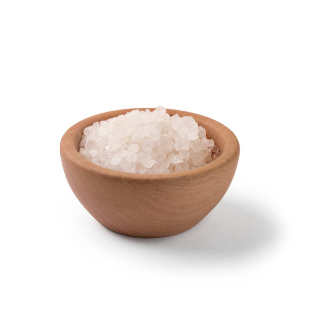 istock Sea salt in wooden bowl on white background with clipping path 914154530