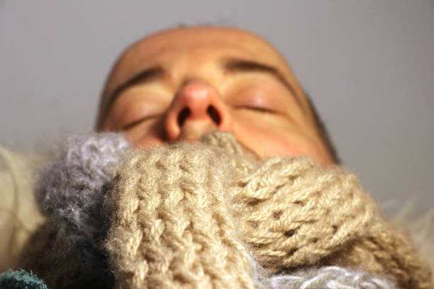 istock wrapped sick man with wool scarfe with flu or cold 914154592