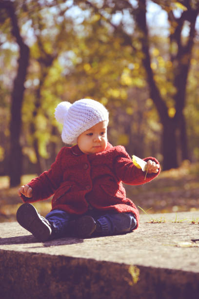 istock Baby in autumn Park 914158822