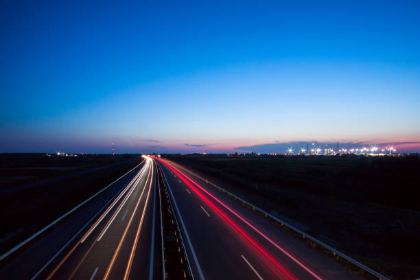 istock Cars speeding on a highway 914159636