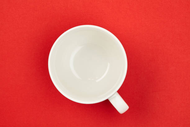 istock Cup. White. Isolated on a red background. For your design. 914162142